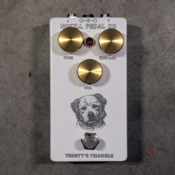 NOKILL Pedal Co Trinity's Triangle pedal — handbuilt Big Muff Triangle fuzz with Tone, Sustain, and Volume knobs, 125B enclosure, original dog-inspired artwork