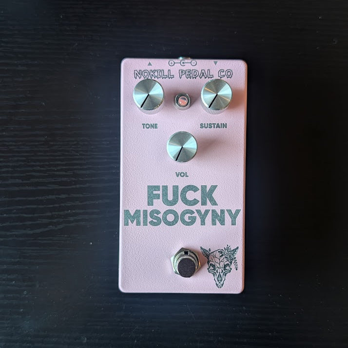 FUCK MISOGYNY - a pink NOKILL fuzz pedal with silver Tone, Sustain and Vol knobs and an engraved wolf skull wreathed in flowers.
